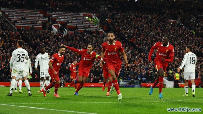 Soccer Football - Champions League - Liverpool v Real Madrid - Anfield, Liverpool, Britain - November 27, 2024 Liverpools Cody Gakpo celebrates scoring their second goal with Mohamed Salah, Virgil van Dijk and Ibrahima Konate REUTERS/Molly Darlington